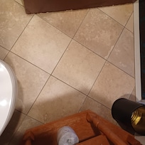 Tiled floor and wooden wash stand