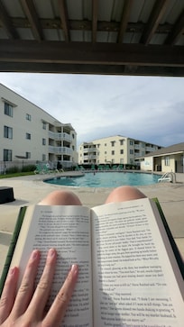 Reading by the poolside.