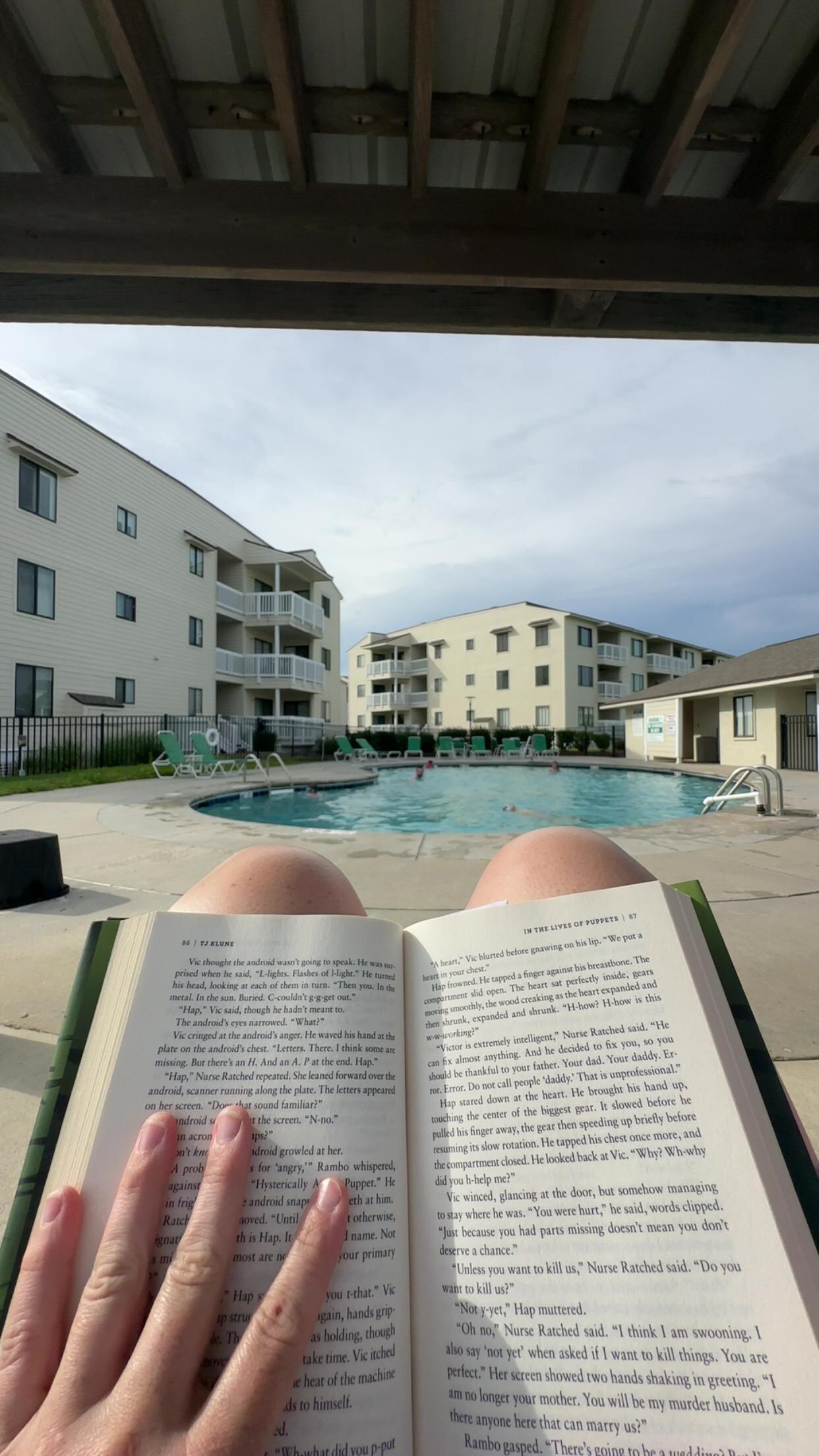 Reading by the poolside. 
