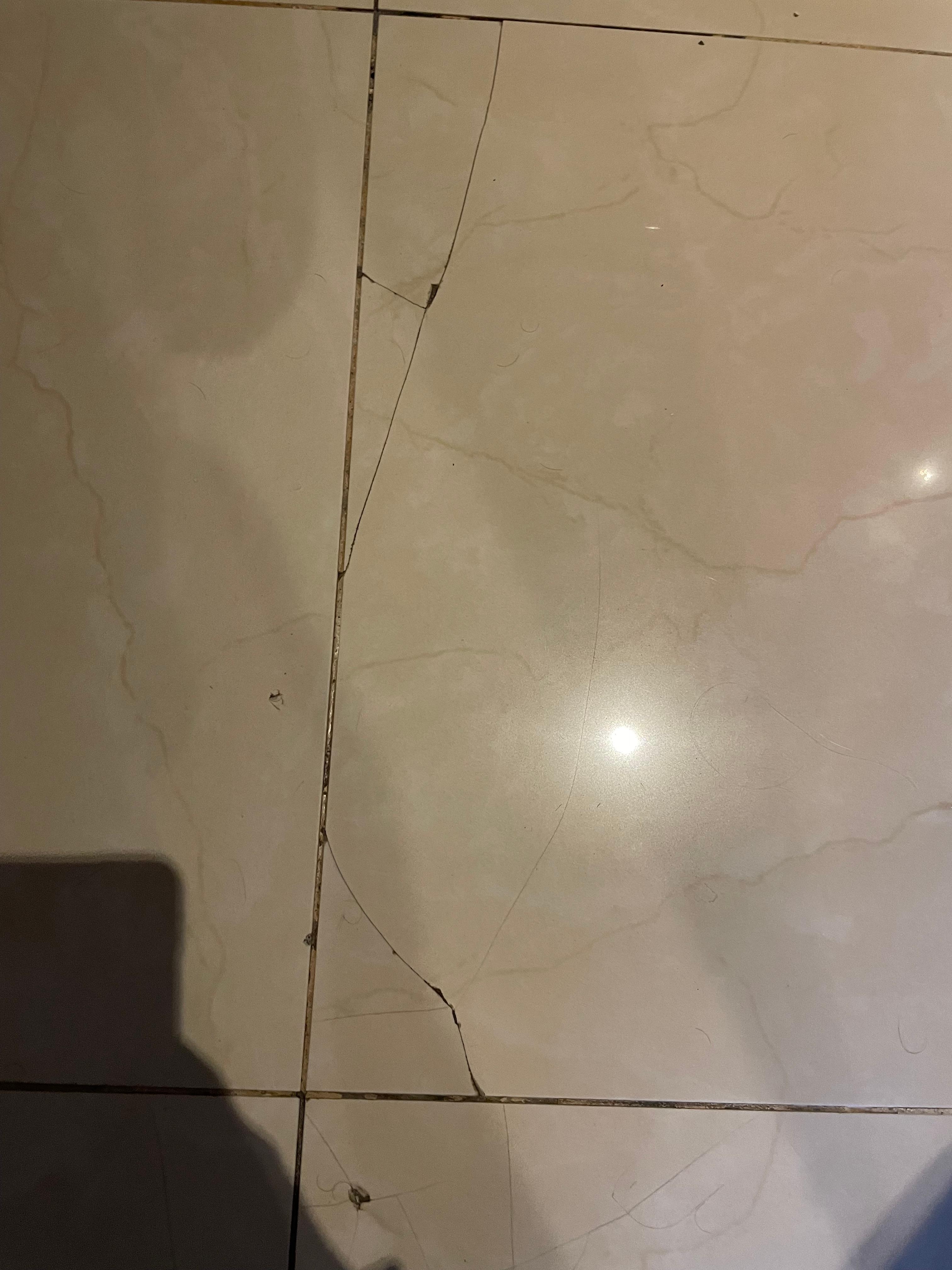 Cracked and sharp floor tiles 