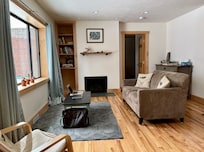 Living room with gas fireplace.