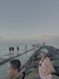 Jetti at Waikiki Beach. Lots of visitors come here to catch the sun rise over the mountains and buildings.