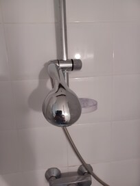 Shower fitting with cable tie