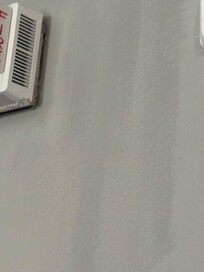 Unidentified dark spots on wall between bedroom and bathroom, maybe water damagr