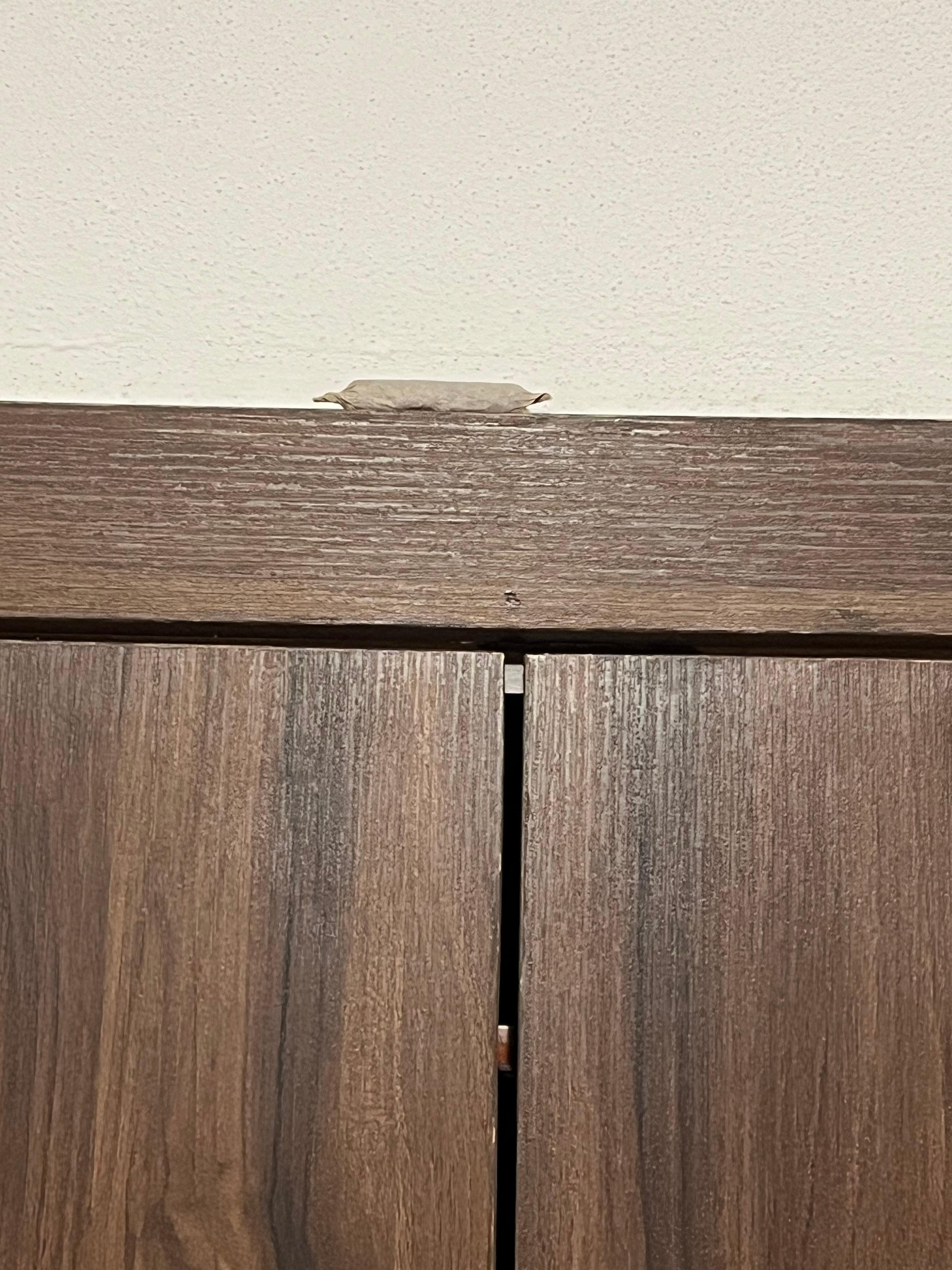 Illegal drugs up on top of trim left by?