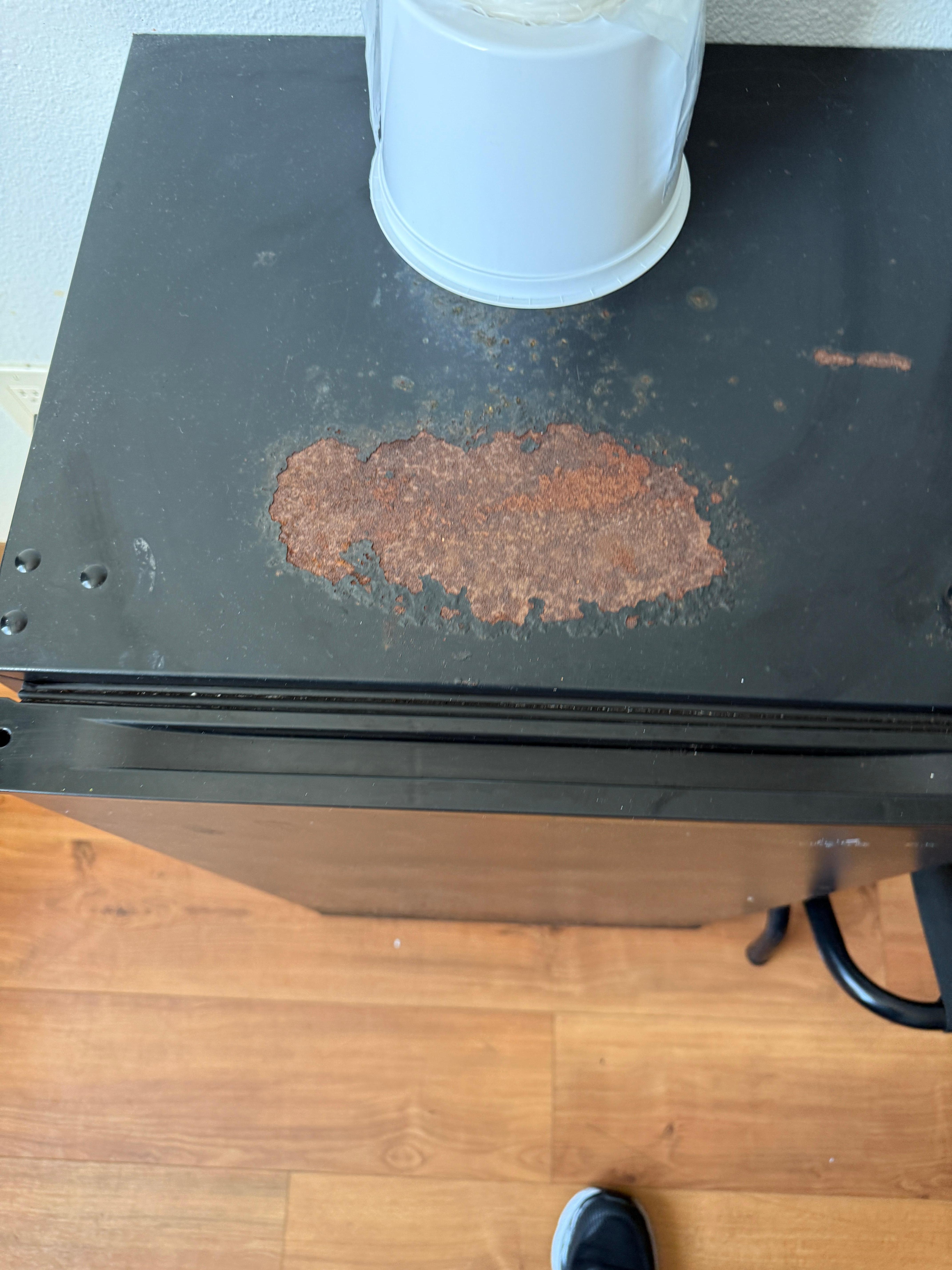 Rust on top of mini fridge 