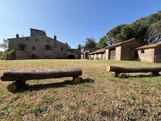 The Front of the home. Volleyball on the grass.
Laundry building on right.