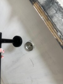 Toilet roll holder fell off.