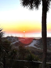 The sunrise view from one of 3 beach front decks just steps from the beach.