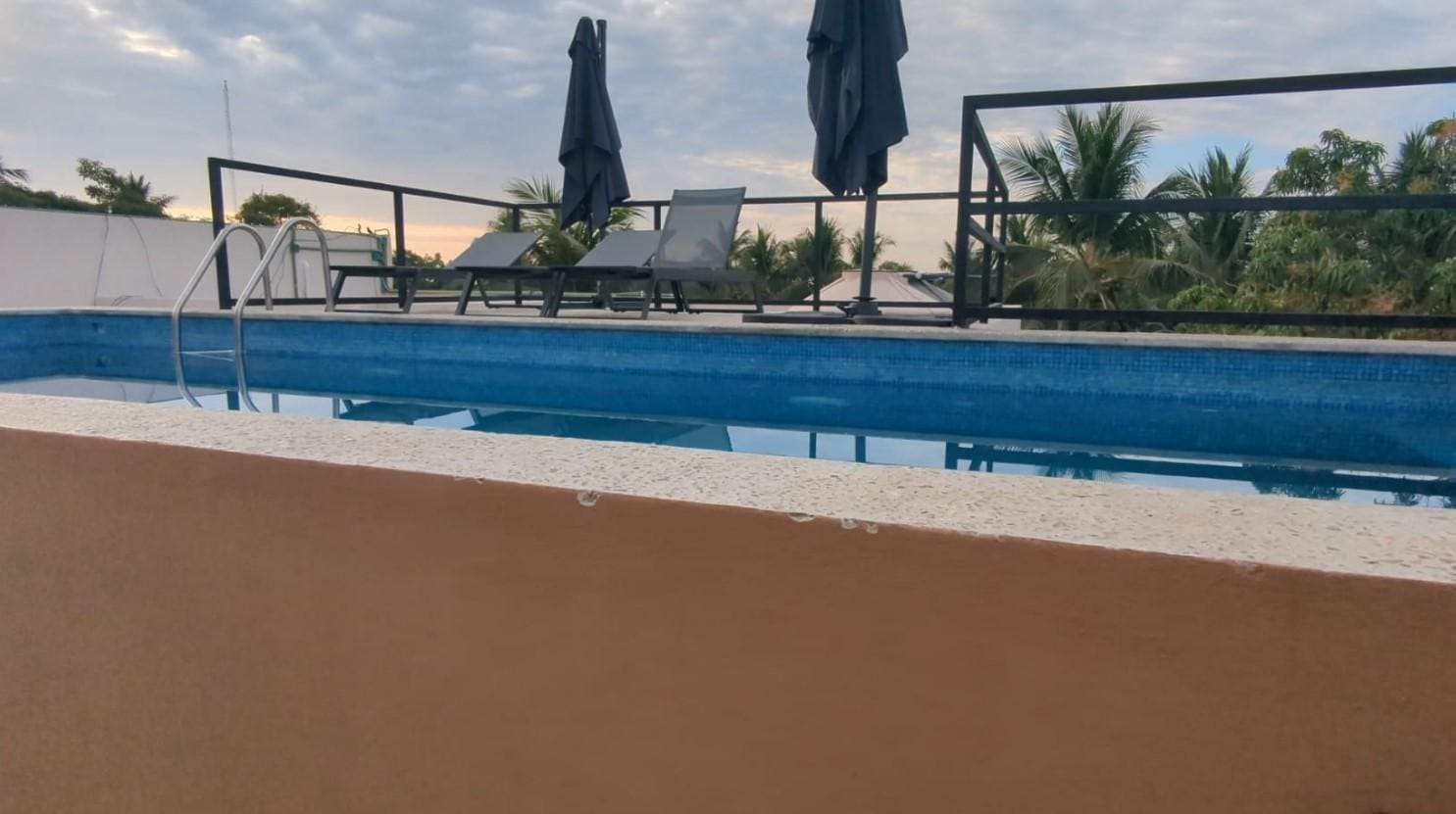 This the small pool where you have to jump in and swim across to the ladder to access the lounge chairs??? Staff didn't turn on power to the area for lights and outlets until I asked. Crazy!