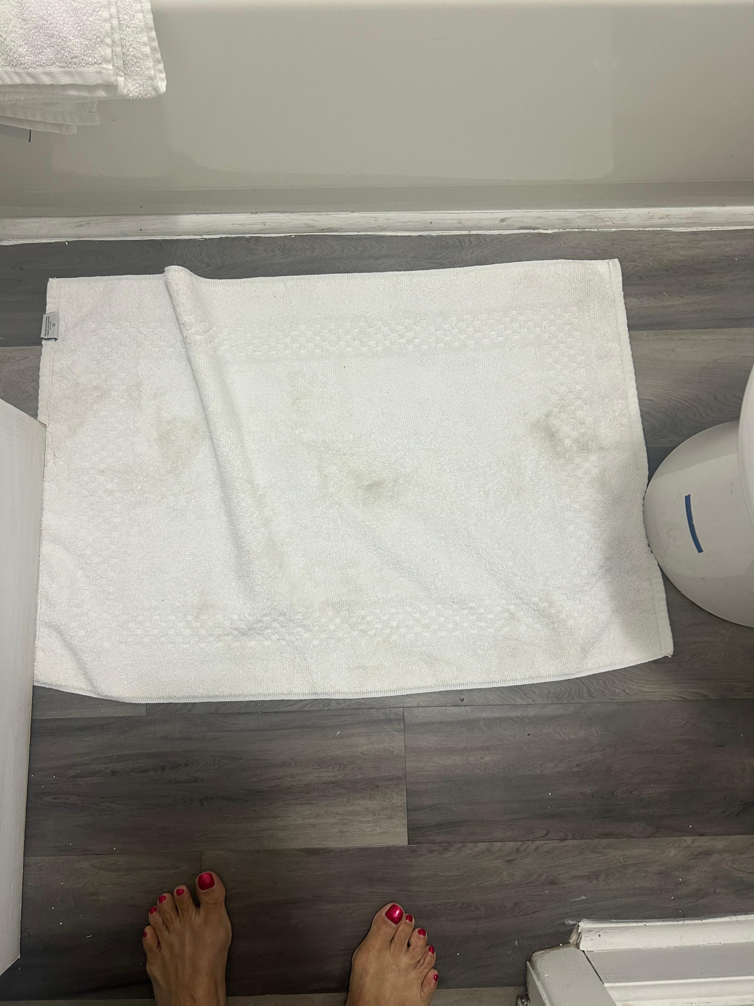 Dirty bath mat given as clean
