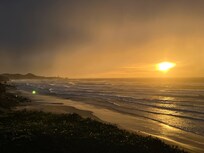 South view from room deck looking near sunset and Yaquina lighthouse