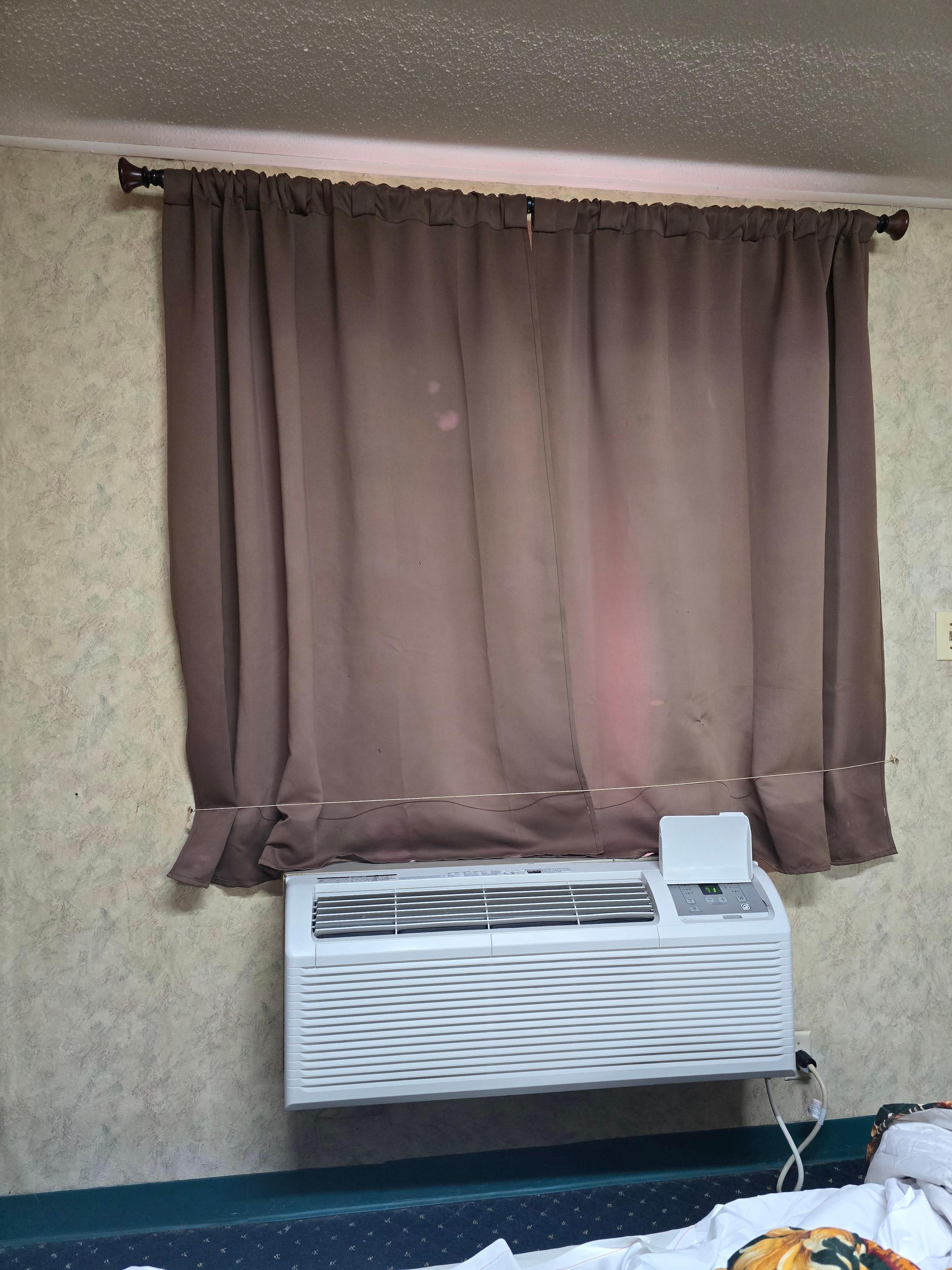 The curtains held closed by a string