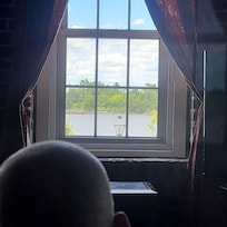 My dad watching the river from the recliner