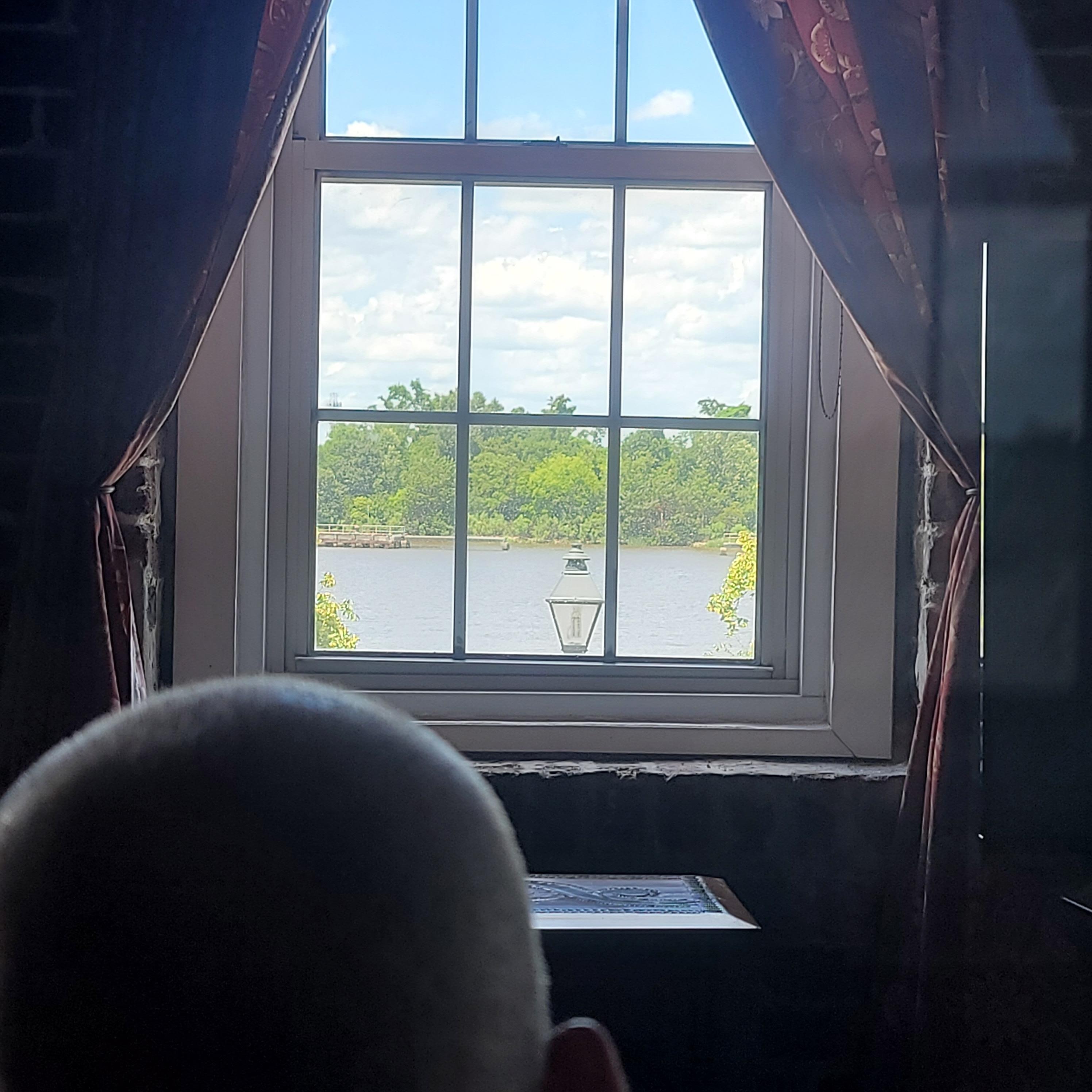 My dad watching the river from the recliner