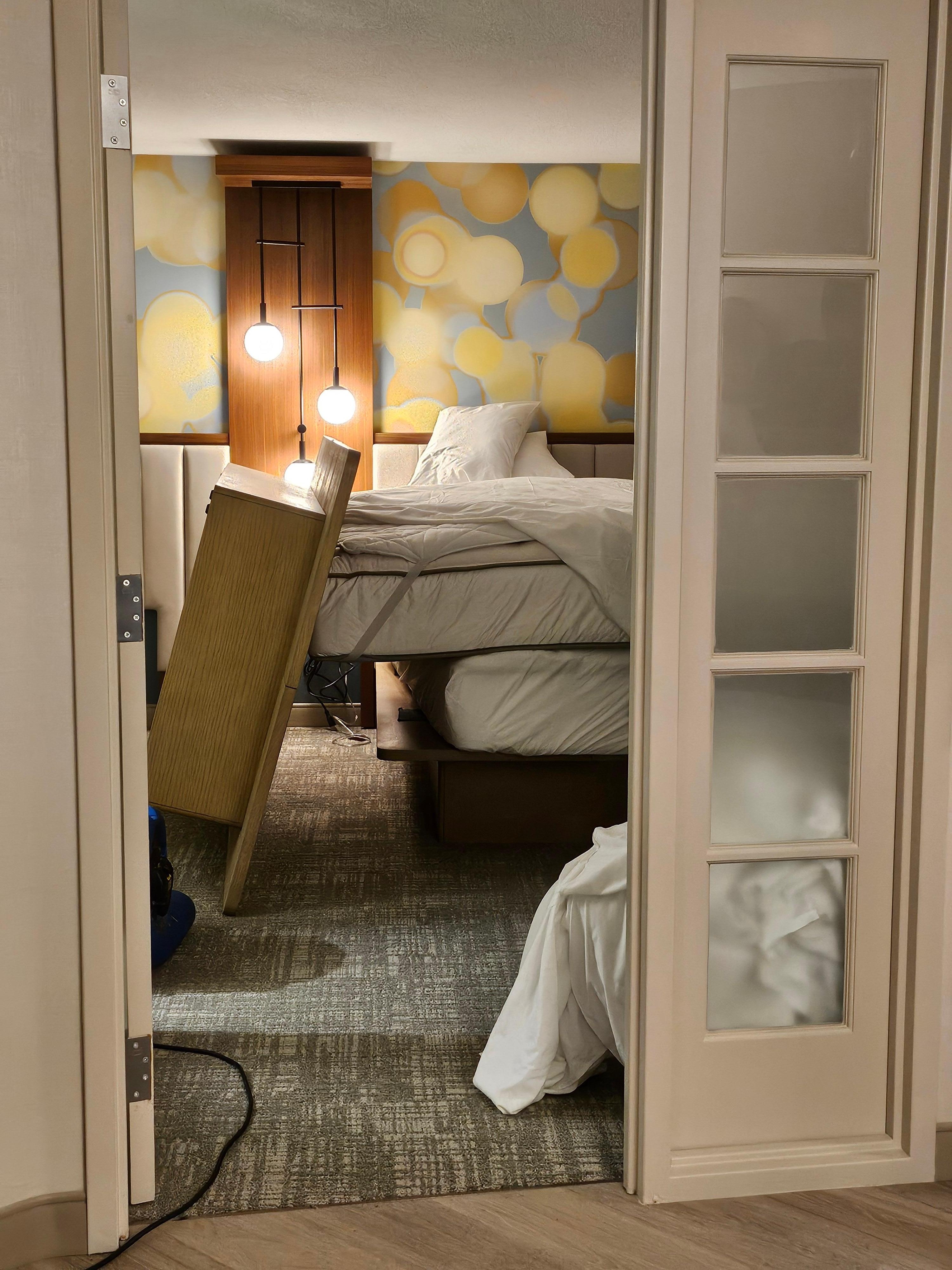 Closer look at the bed and the disarray 