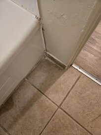 Terrible patch job, looks like black mold underneath