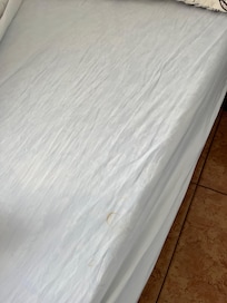 Stained sheets , unironed too