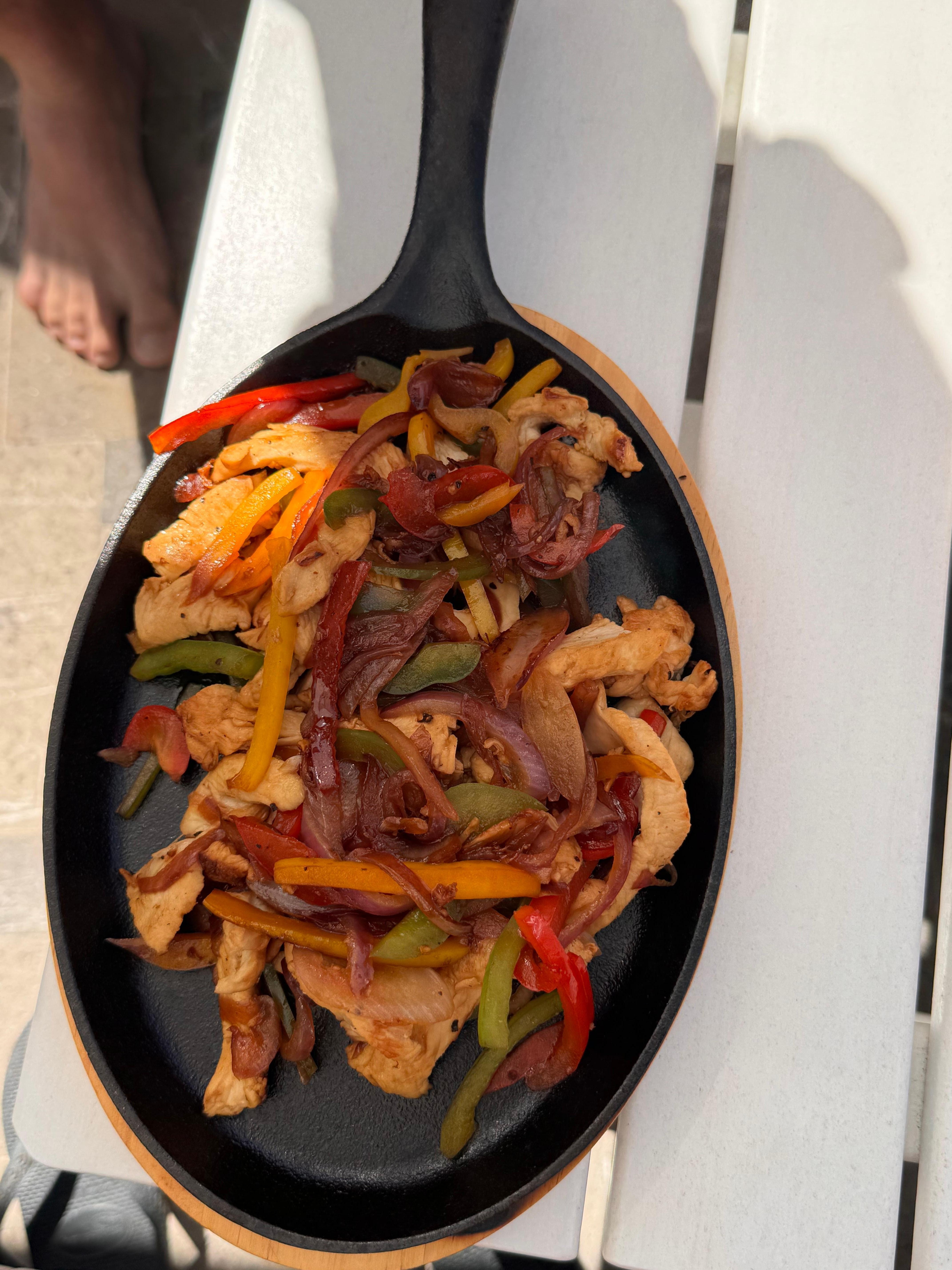 The fajita on the menu is incredible, eat it poolside!