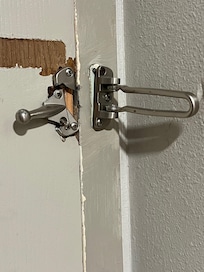 This door was kicked in at some point, the lock is broken