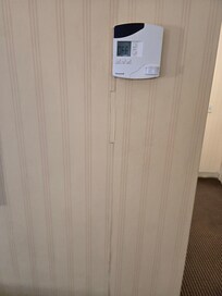 This is wireless and fell out the wall when adjusting temp