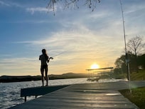 Fishing off the pier that extends from the boat dock.