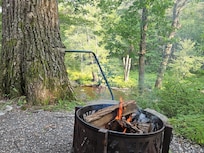 Firepit overlooking the flowering river and woods