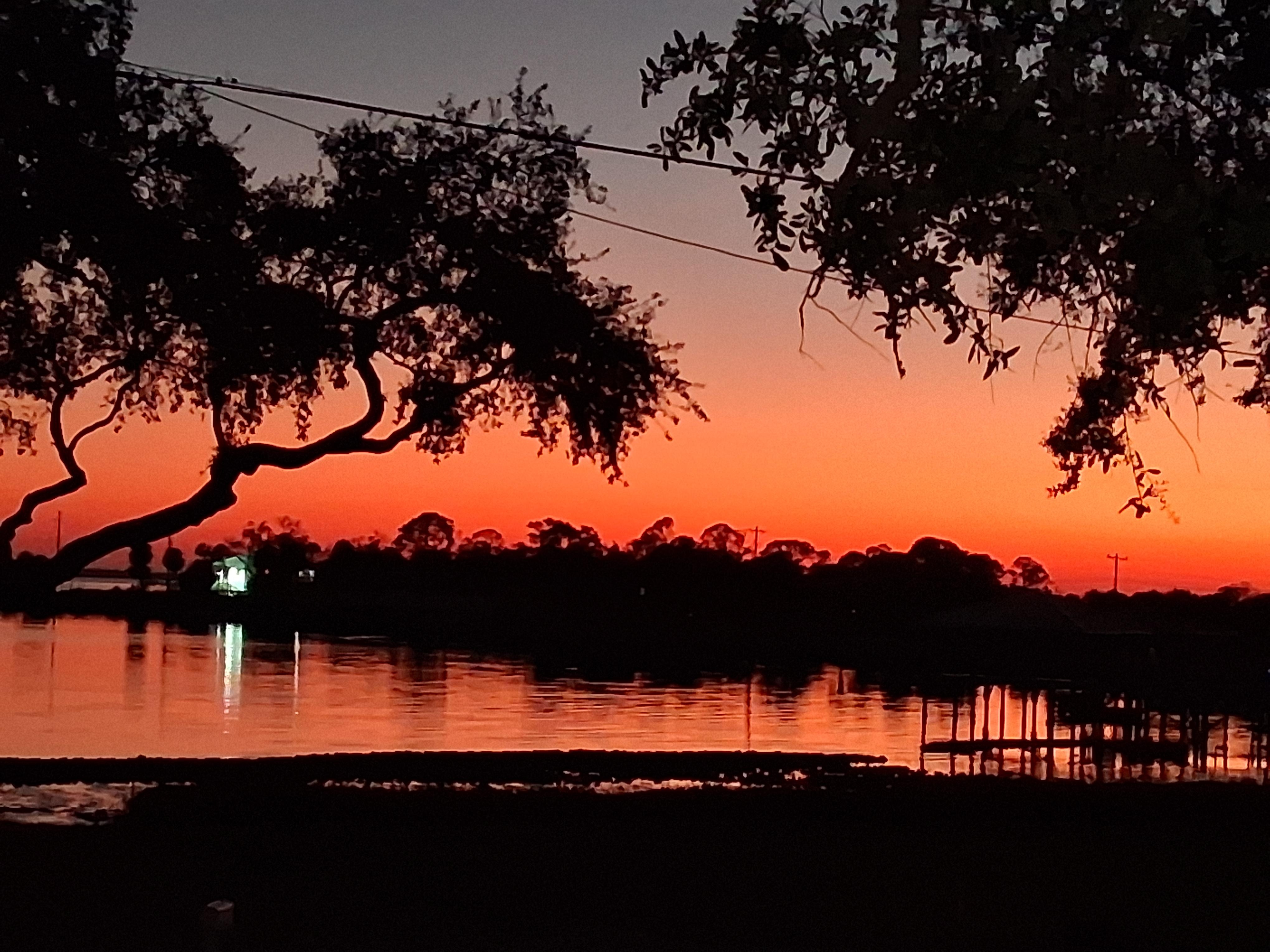 Sunset off the front deck..This will be your view for your stay!