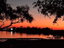 Sunset off the front deck..This will be your view for your stay!