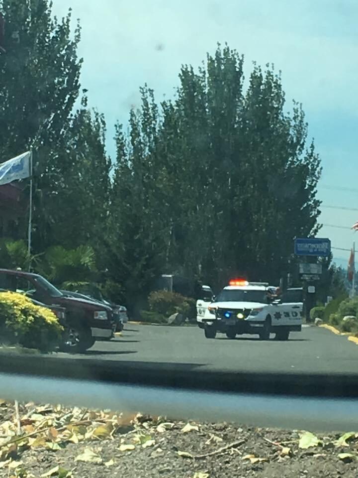 Lady being removed by gun point for being late to checkout