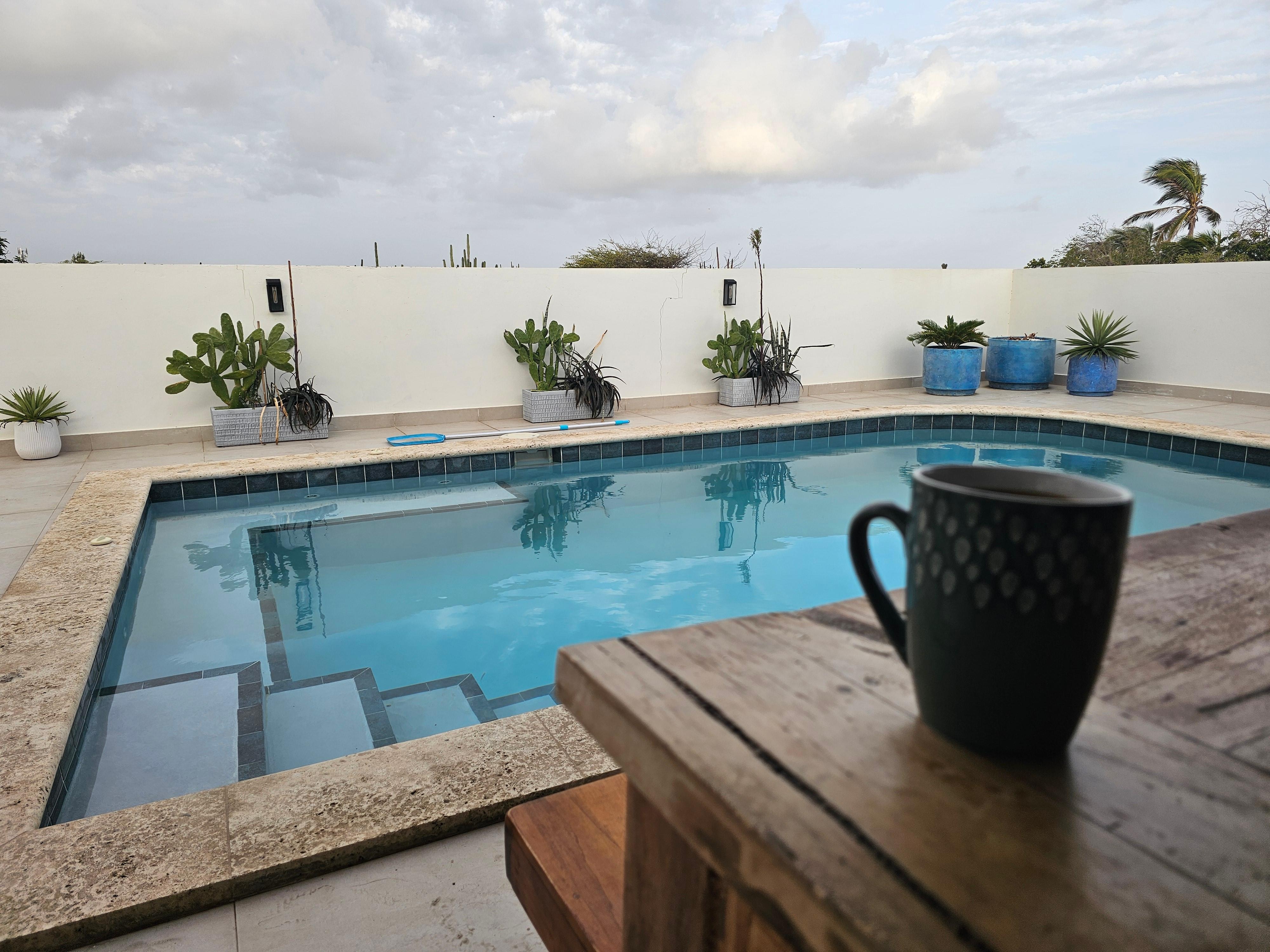 Enjoying a morning cup of coffee on the patio