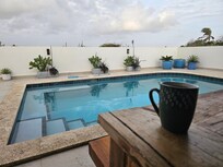 Enjoying a morning cup of coffee on the patio