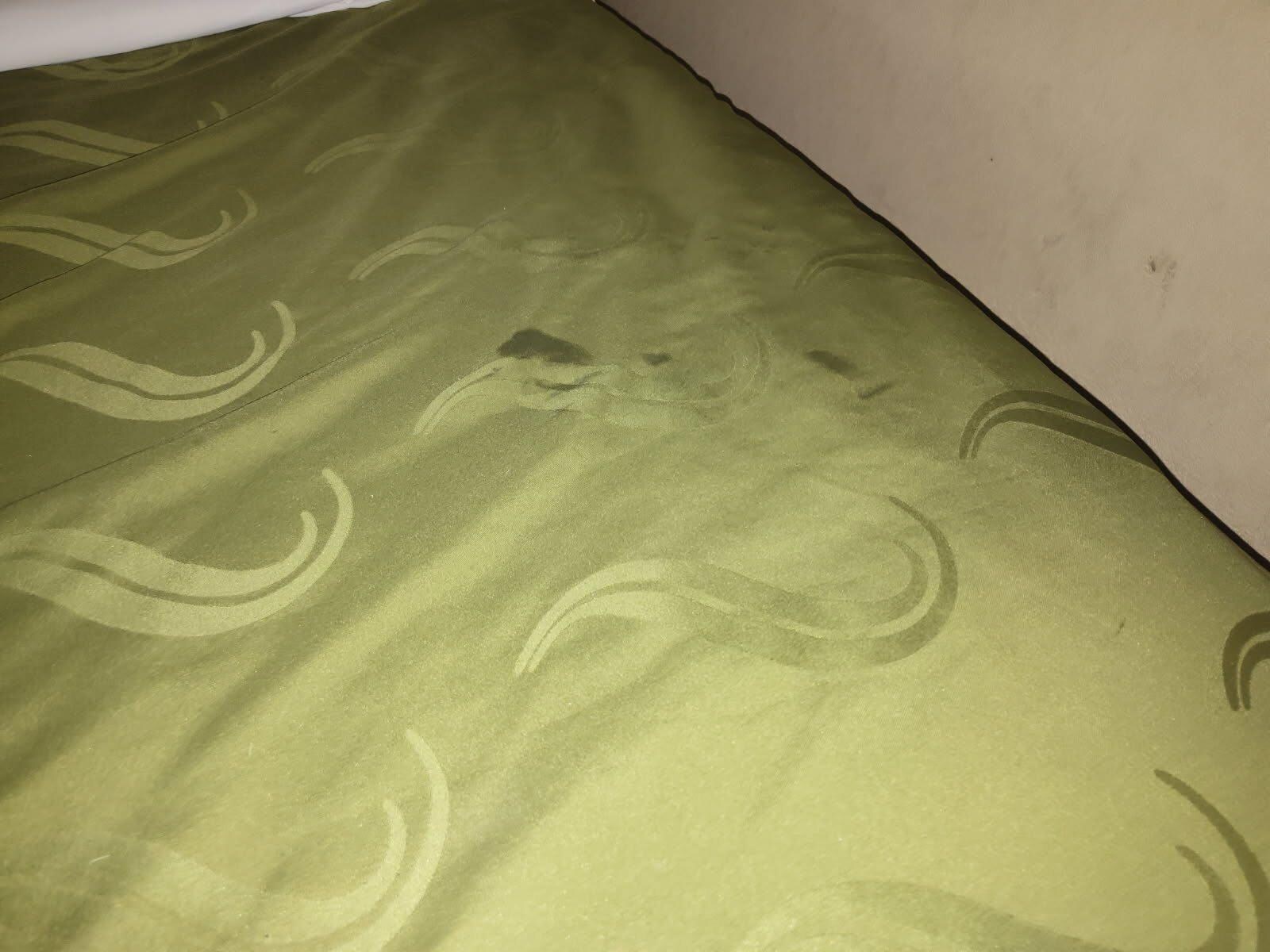 Dirty bed with stains