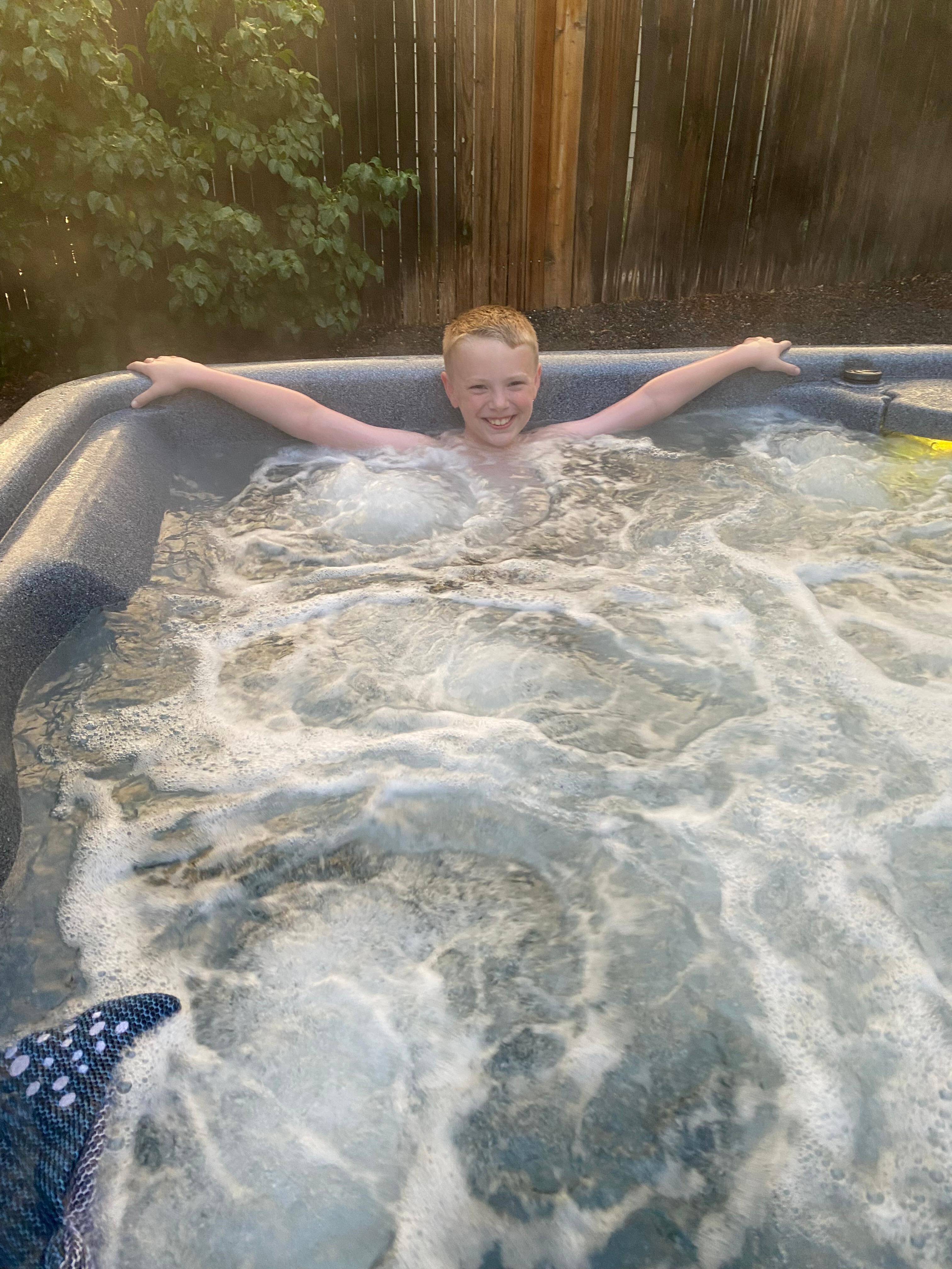 Enjoying the hot tub at the house