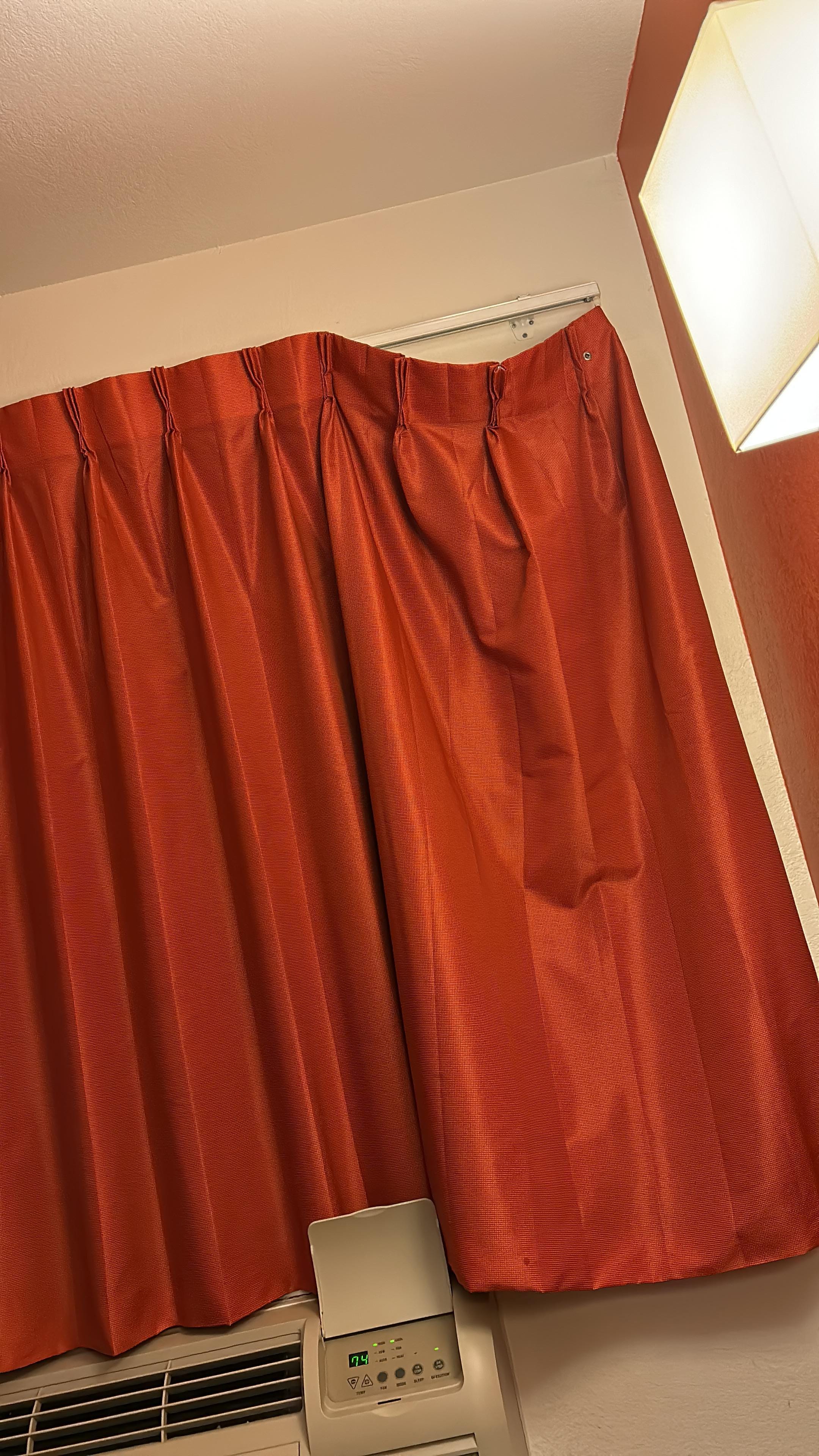 Curtain not completely hung.
