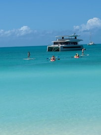 Standing up to knees way out in ocean