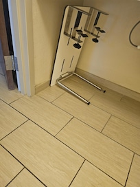 Bathroom used as store for table under the sink