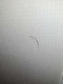 Punched in wall