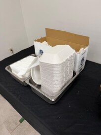 They ran out of actual plates so they gave to go containers that were cut in half.
