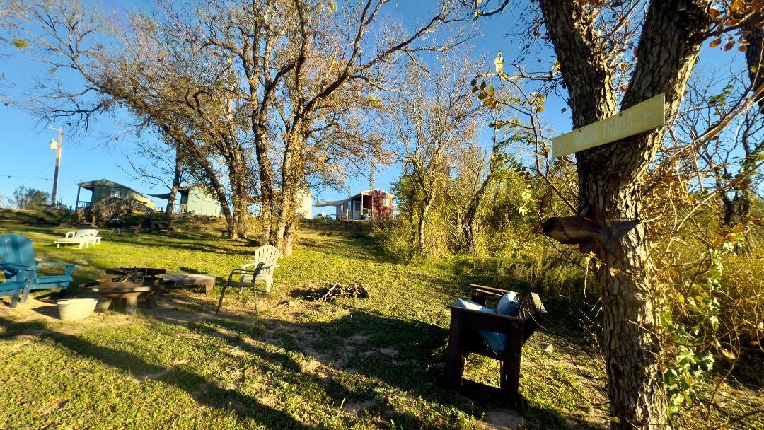 view of cabins from bottom of backyard