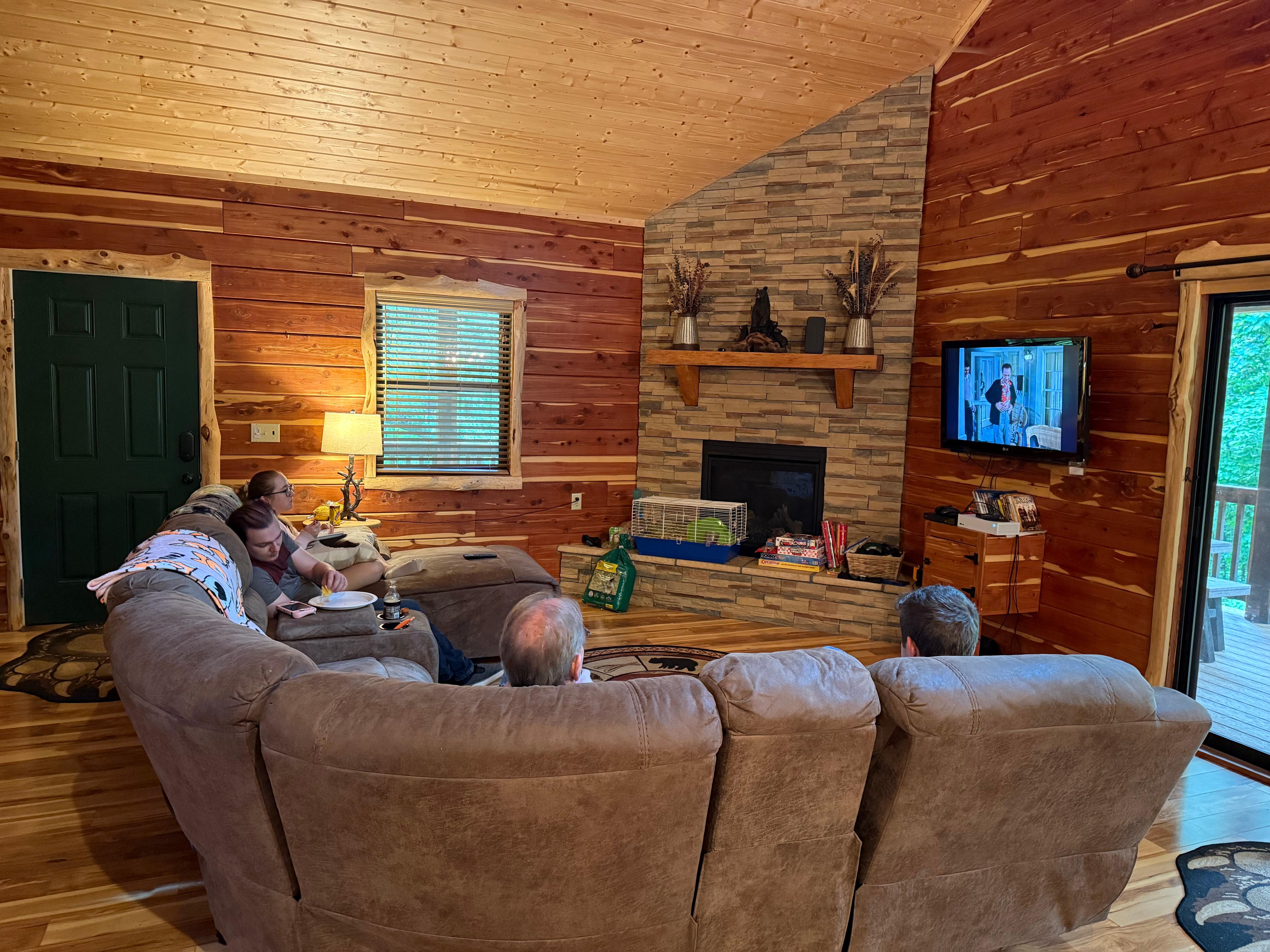 My family relaxing and watching tv together.