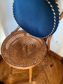 Broken chair at the dining table.