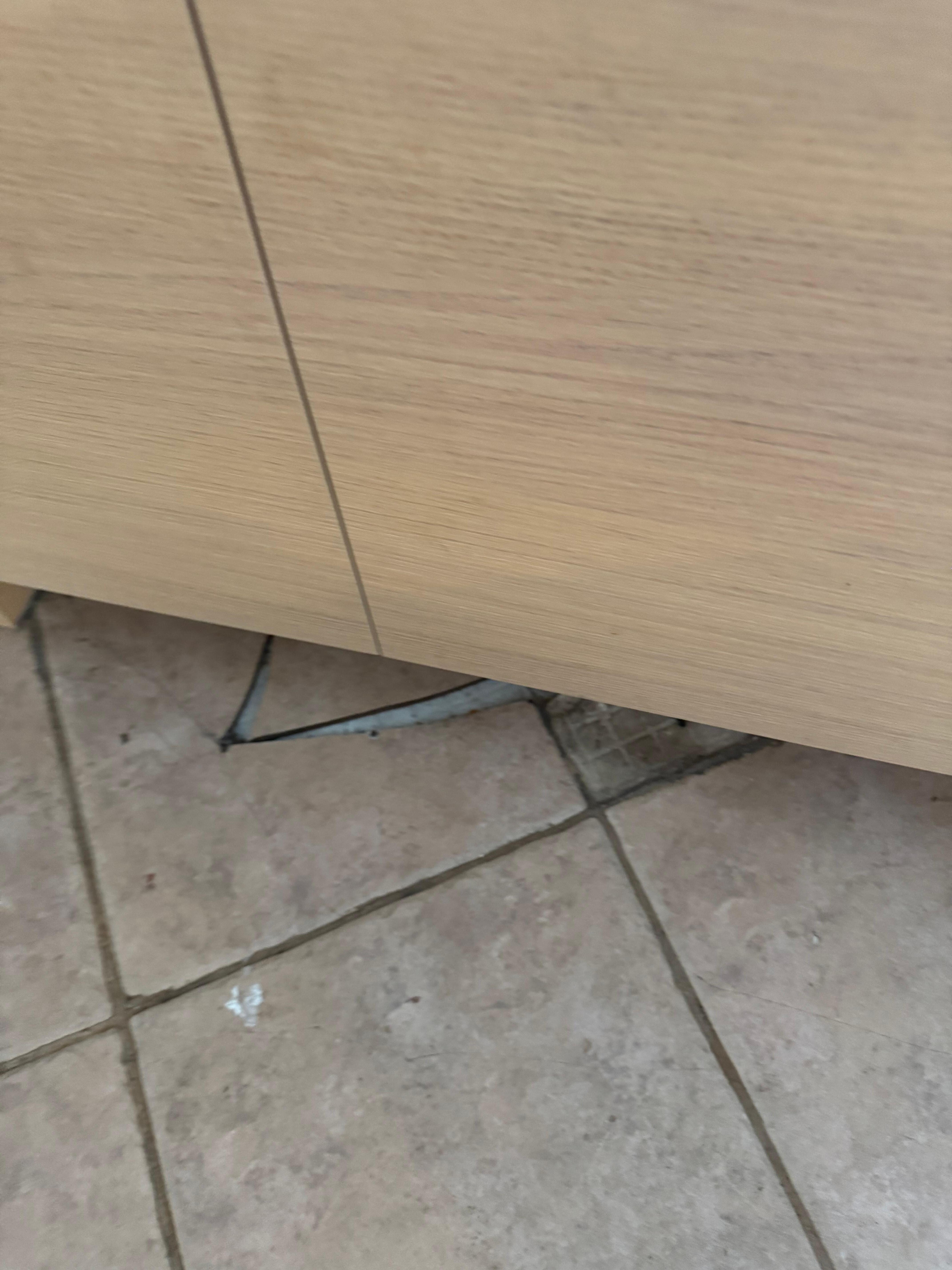 Cracks in tile in the floor.