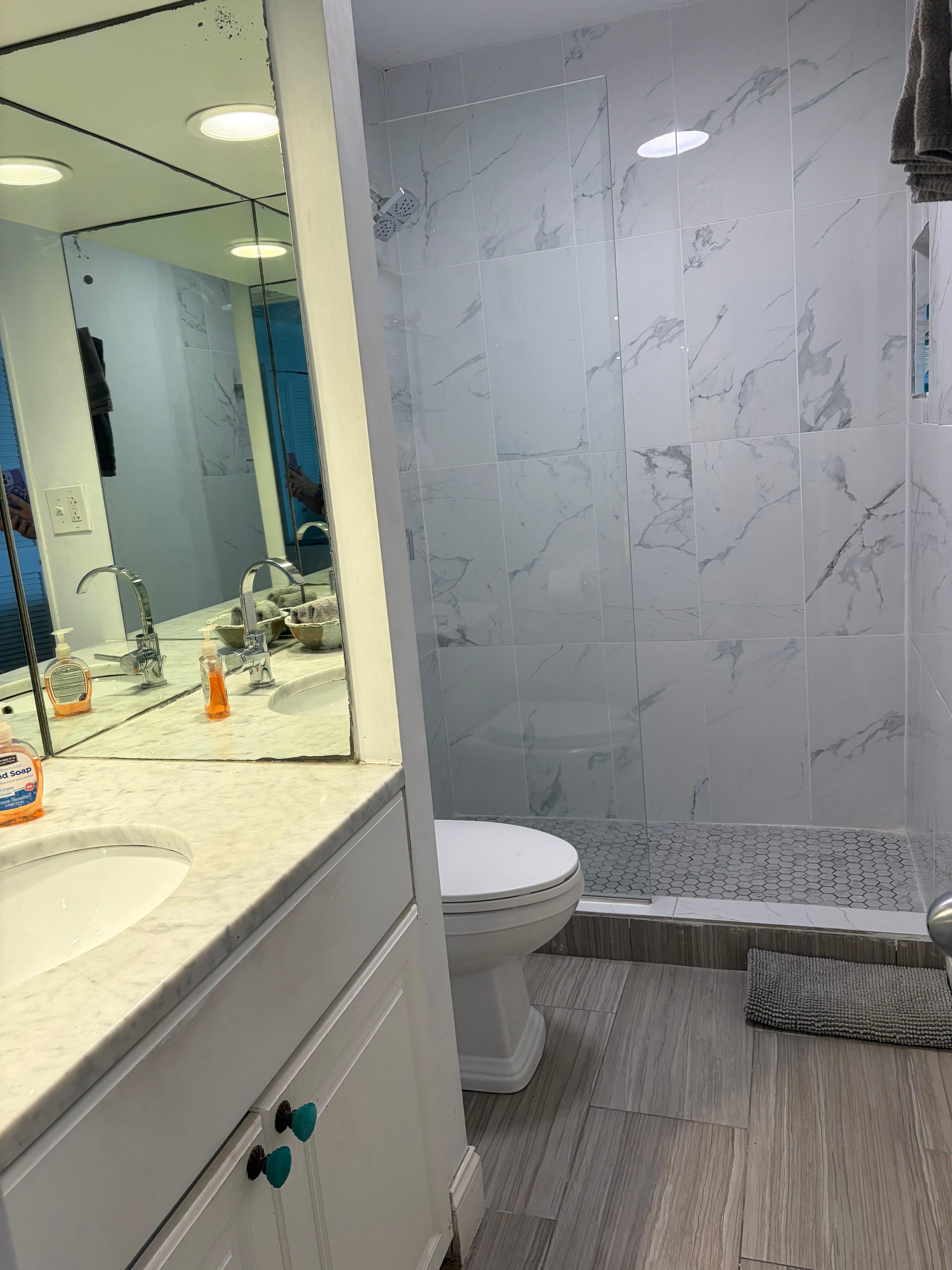 Bathroom with comfort height toilet. 