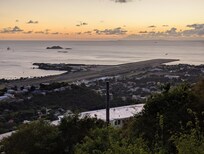 Delta 757 aircraft taking off from Cyril E. King Airport at Dusk