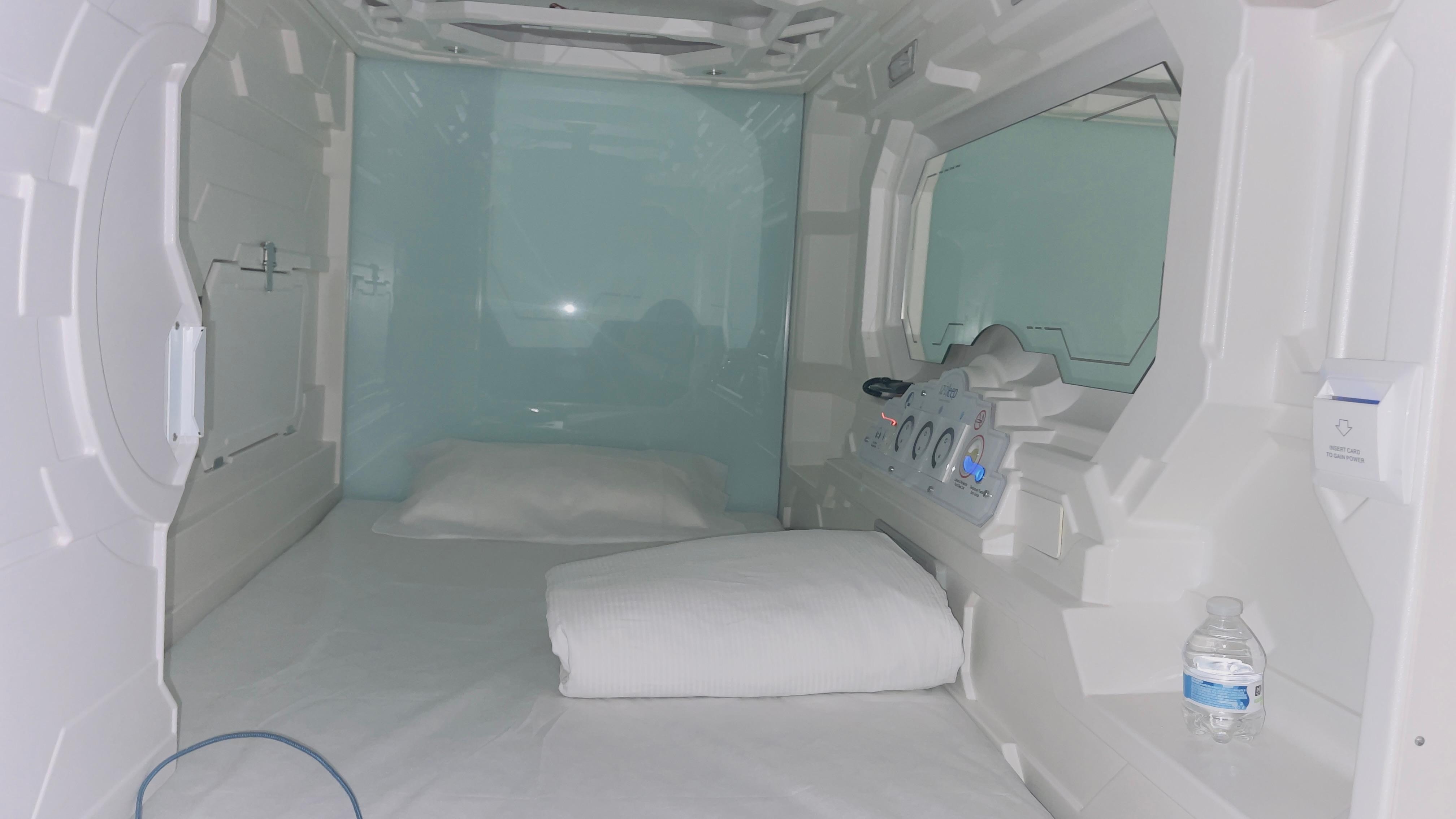 Inside capsule blue lights on ceiling give an indirect starlight effect if desired. Charging ports and outlet provided