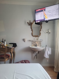 Tv over sink in room