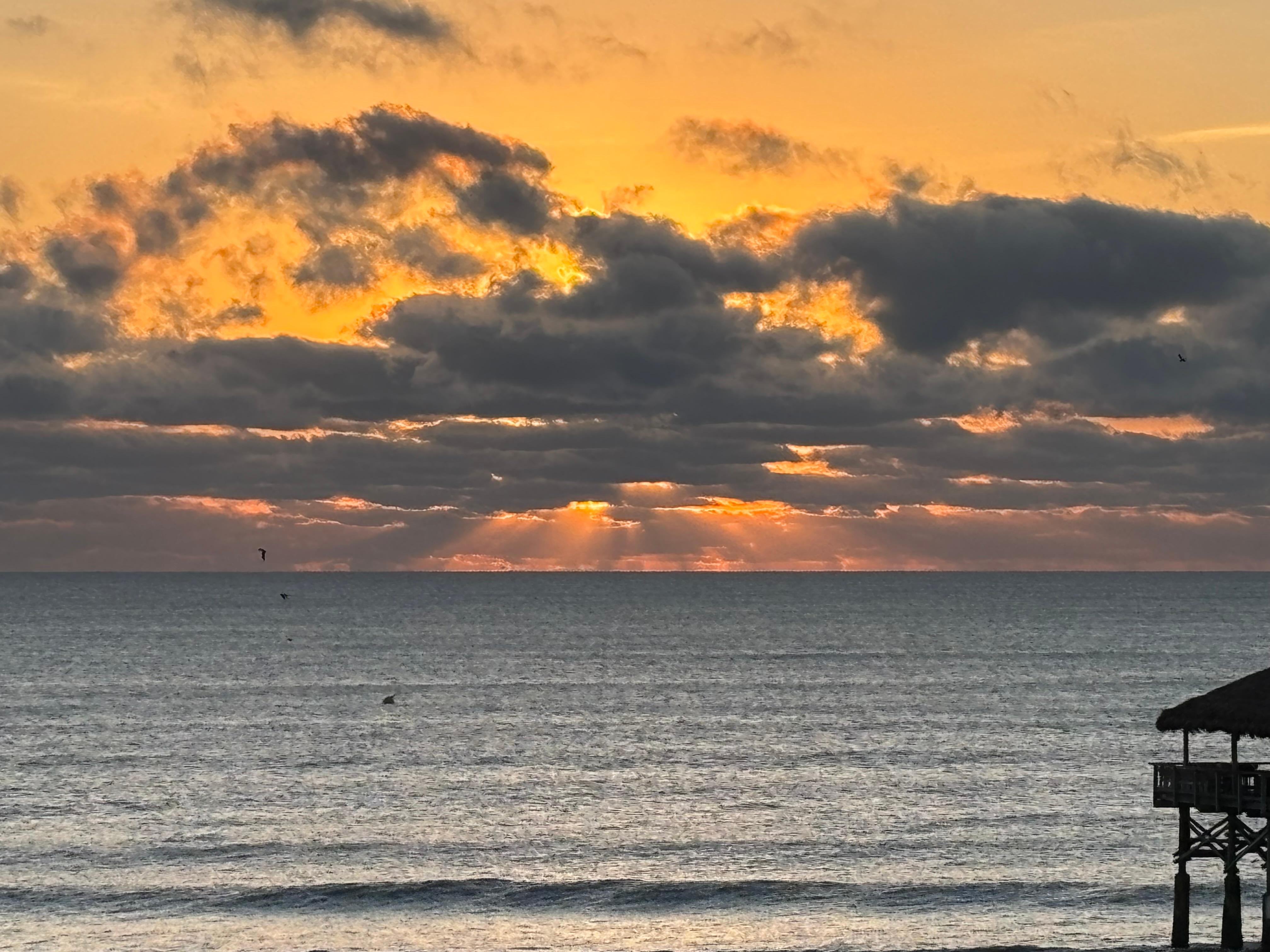 Sunrise from our Ocean-view balcony.