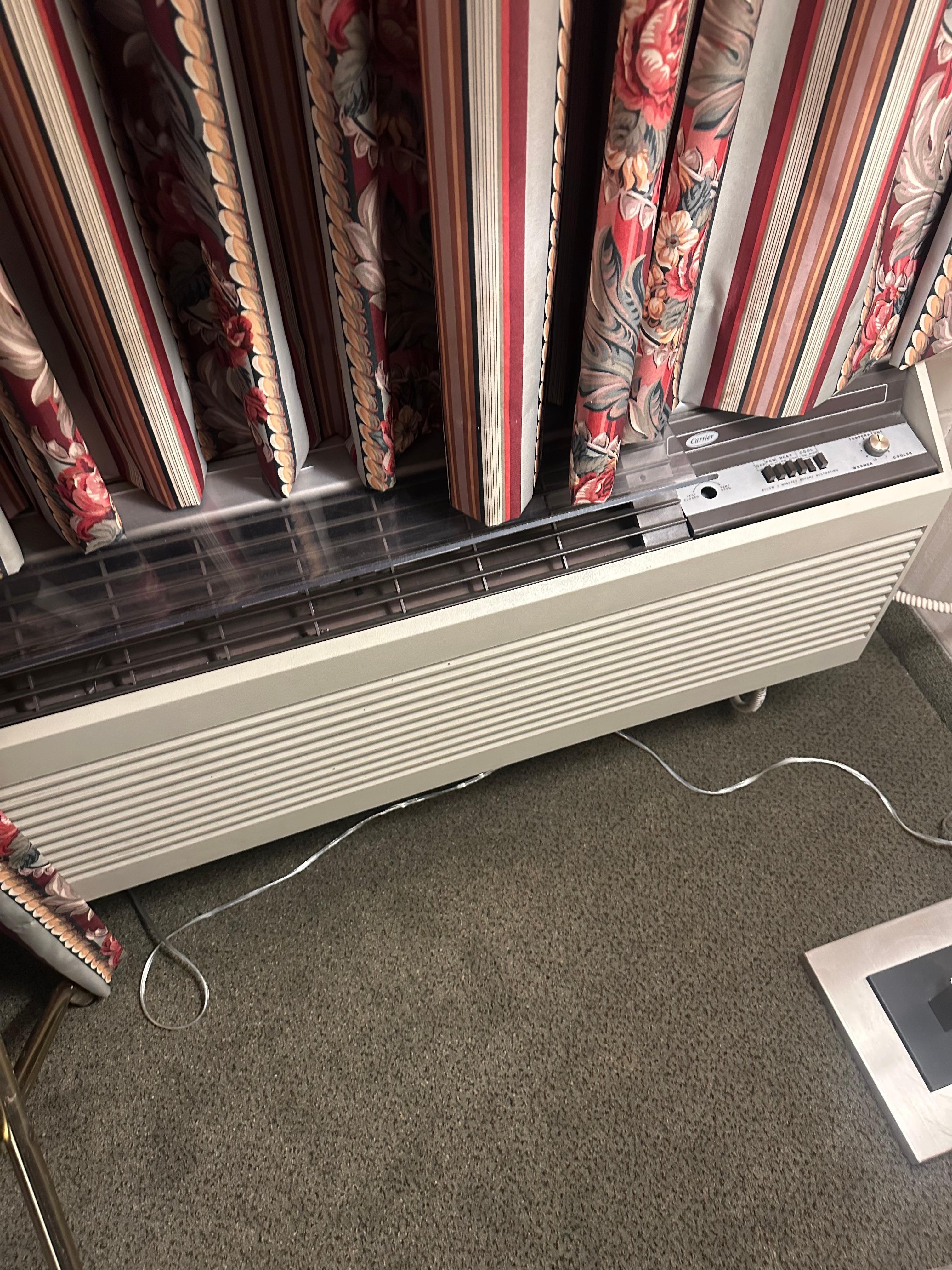 The dated AC system adds to the ancient odor in the room