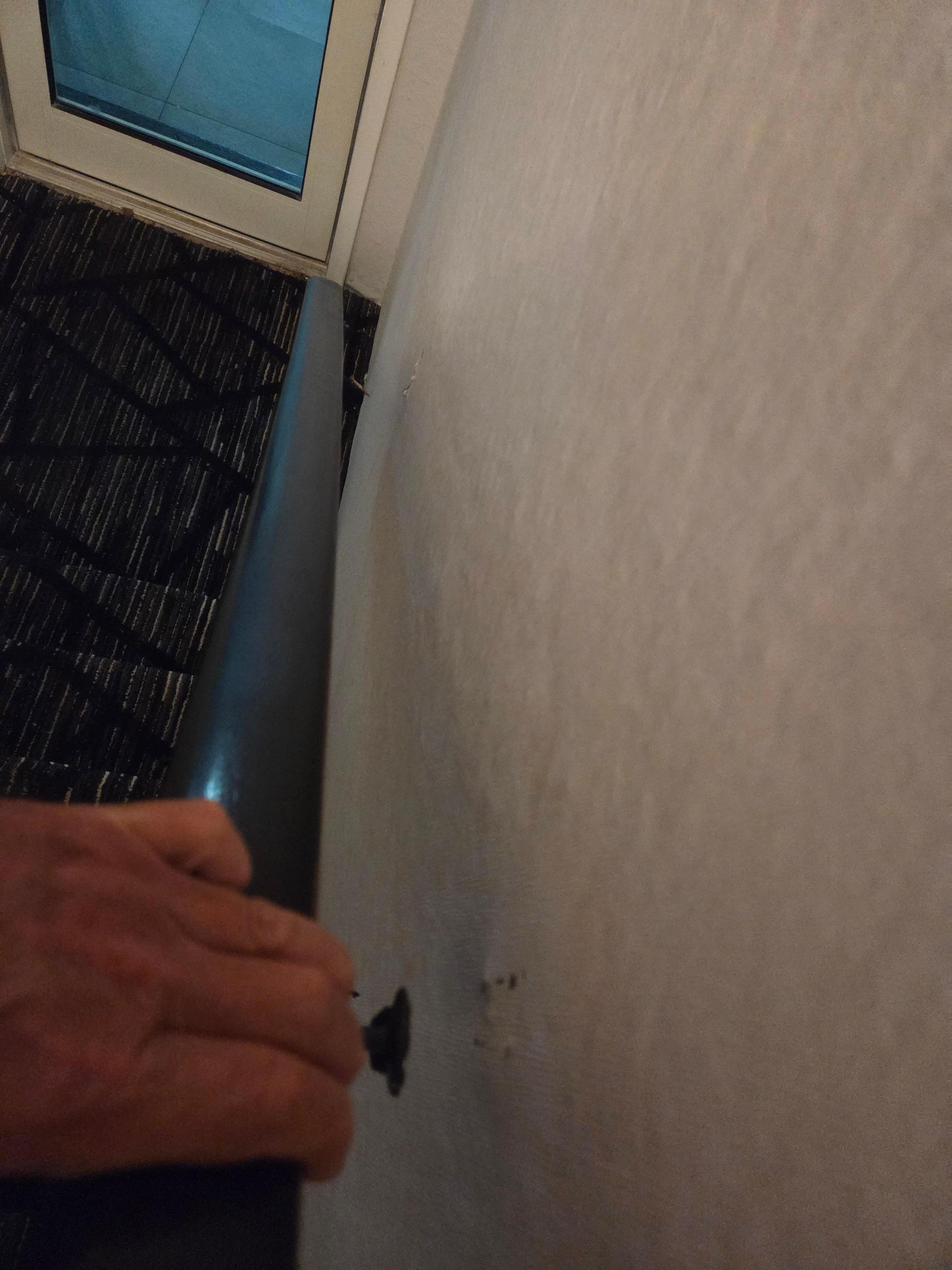 Railing came off wall causing stumble. 